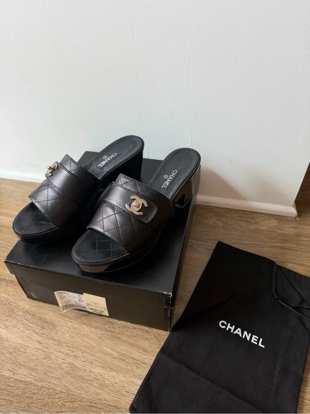 CHANEL Black Quilted Leather Slide Mules